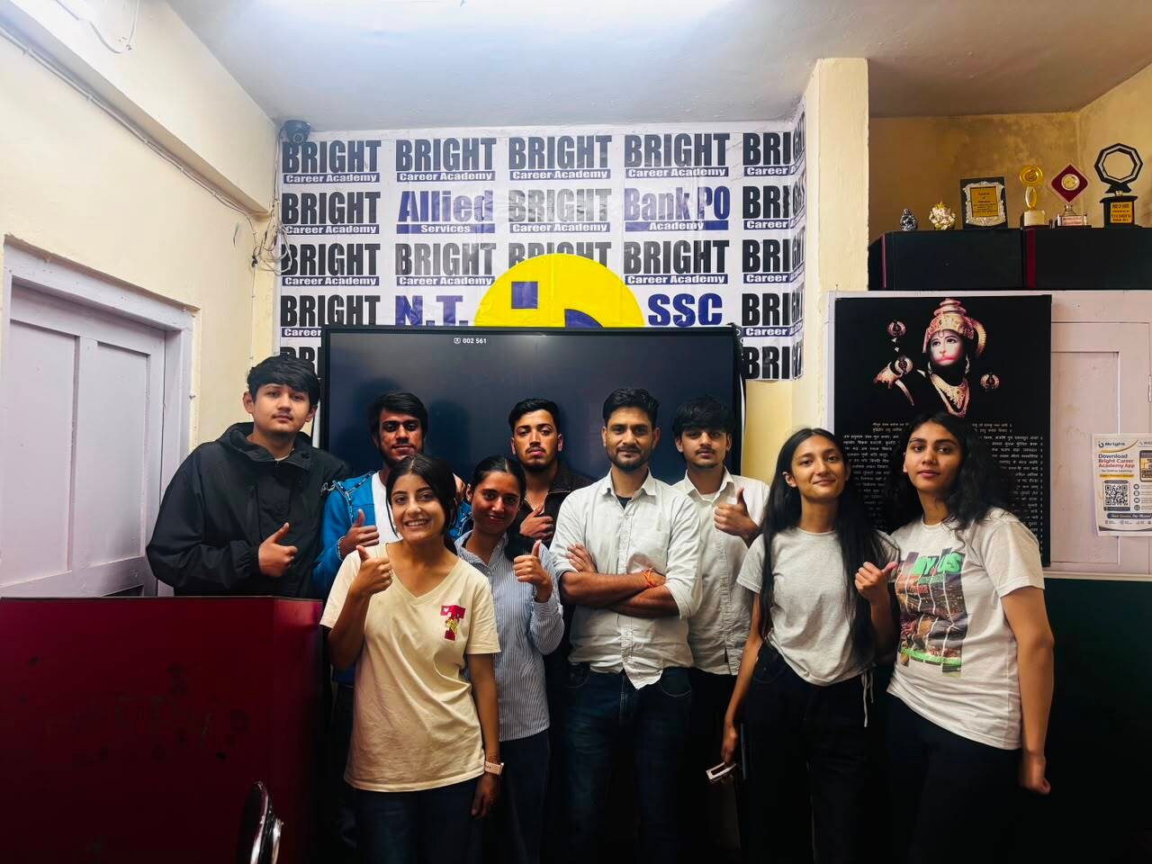 Successful digital marketing batch students standing with trainer in smart classroom during practical